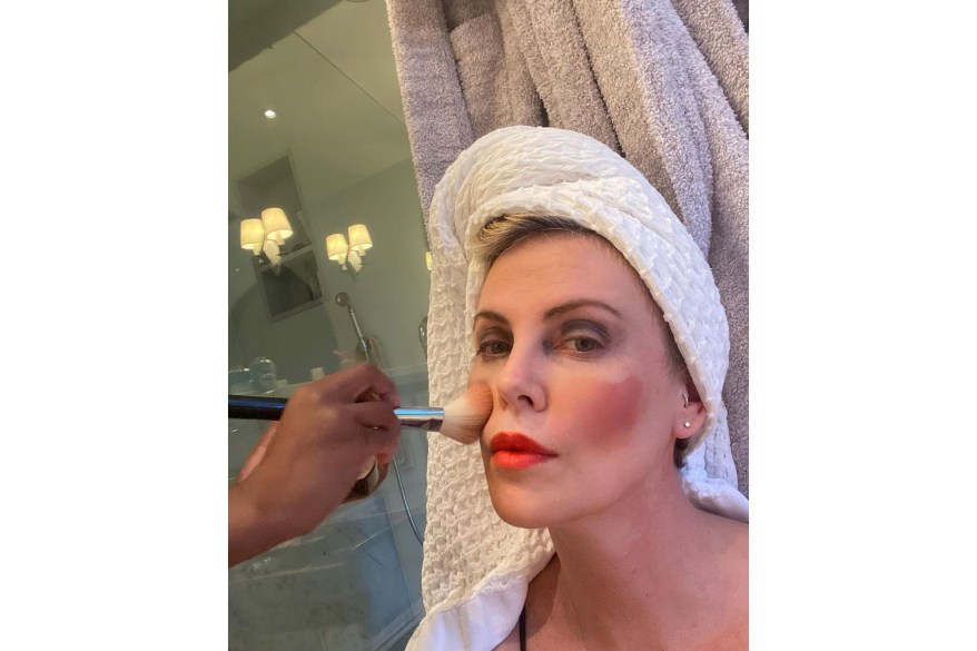 One of Charlize Theron's daughters does her makeup.