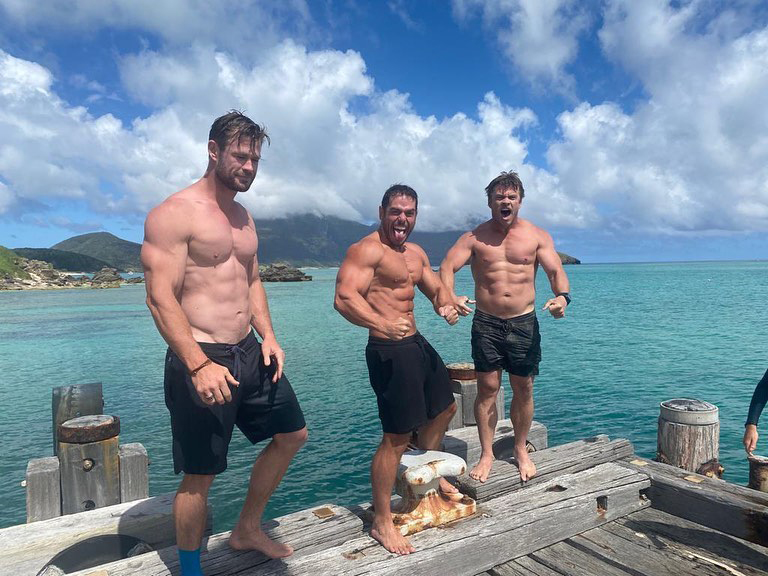 Chris Hemsworth vacations with his ripped friends on Lord Howe Island in Australia.