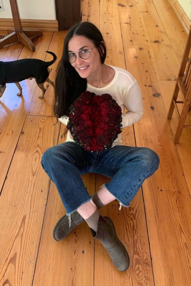 Demi Moore clutches a "floral vagina sculpture" made by Eric Buterbaugh to support reproductive rights.