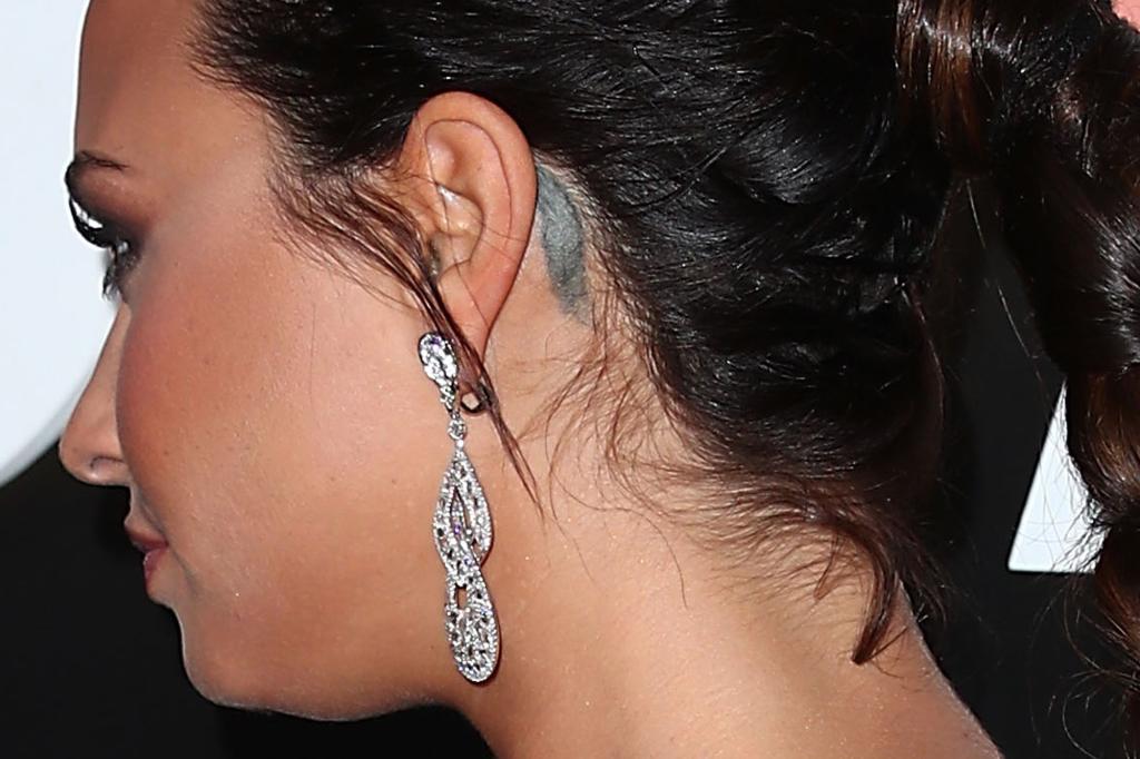 Demi Lovato feather tattoo