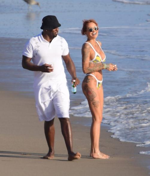 Diddy and model Tina Louise take a stroll on the beach