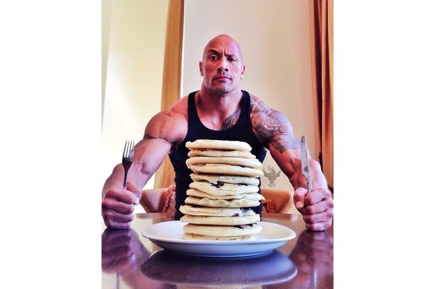 “The Rock” Johnson, who has been teasing a return to the wrestling ring, enjoys a mighty plate of pancakes.