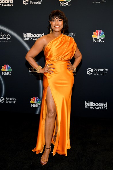 Garcelle Beauvais, who presented during the show, stood out in an orange gown.