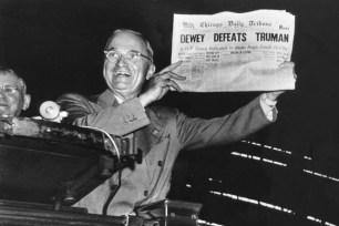 President Harry S. Truman holds a Chicago newspaper falsely predicting his loss to Thomas E. Dewey