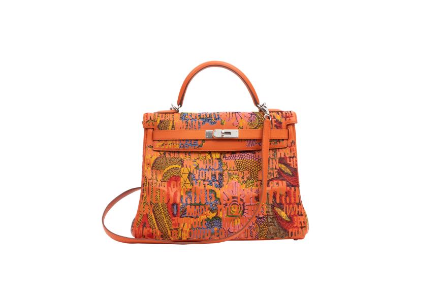 This vintage Kelly Retourne 32 in the classic Hermès orange is adorned with motifs from Central to West African prints, along with lyrics from Lauryn Hill's song "Everything is Everything" emblazoned across the bag's negative space.