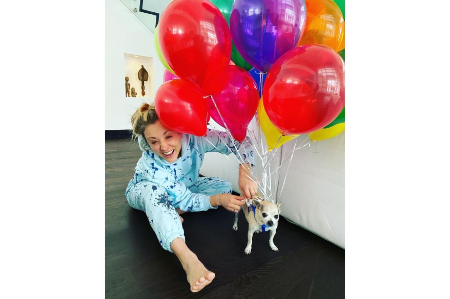 Kaley Cuoco attempts to stave off her quarantine boredom by making her dog fly with balloons.