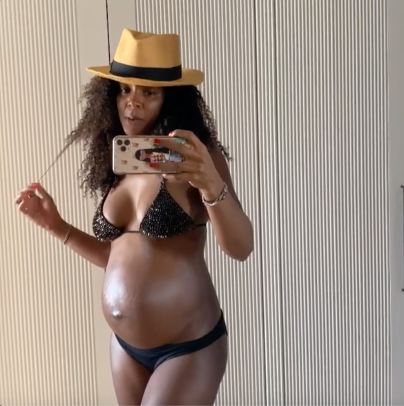 Kelly Rowland poses in a bikini during her sixth month of pregnancy.