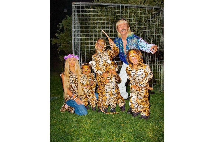 In Calabasas, Calif., Kim Kardashian West, kids Psalm, 1, North, 7, Chicago, 2, and Saint, 4, and best friend Jonathan "Foodgod" Cheban dress up as Carole Baskin, Joe Exotic and a litter of tigers from "Tiger King."