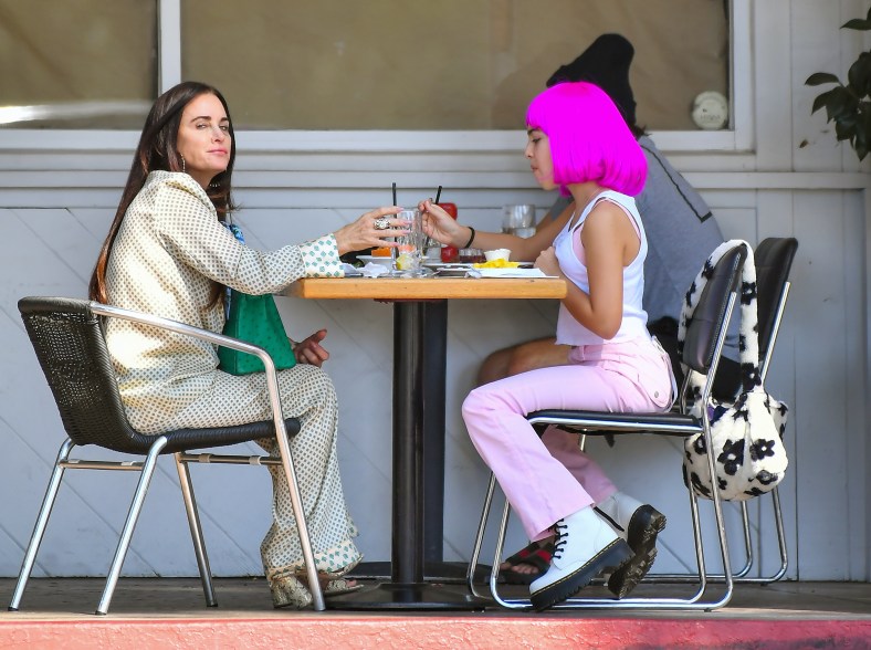 Kyle Richard's daughter, Portia, stands out with a purple wig as they step out for brunch in Beverly Hills.