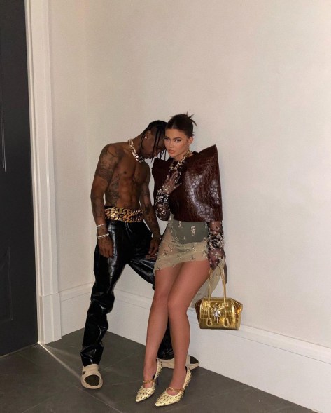 Travis Scott and Kylie Jenner look glam during an at-home photo shoot.