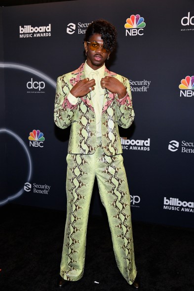 "Old Town Road" singer Lil Nas X channeled Prince in snakeskin-print Gucci. He took home Top Streaming Song, Top Selling Song, Top Rap Song and Top Hot 100 Song for his smash hit.