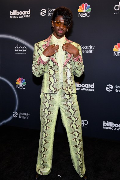 Lil Nas X opts for a flashy snakeskin suit at the Billboard Music Awards in LA.