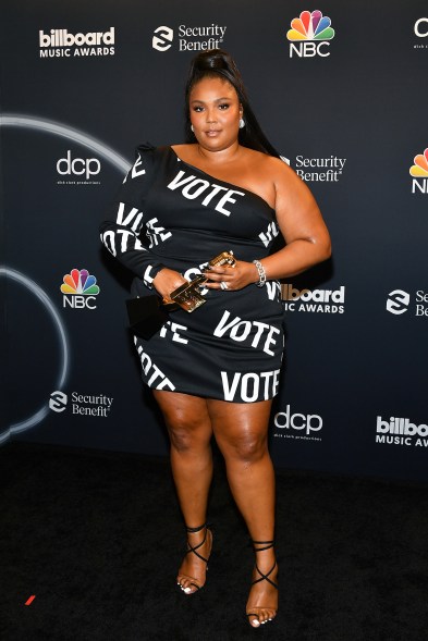 Lizzo accepted her award for Top Song Sales Artist in a Christian Siriano "Vote" dress that sent a message in more ways than one.