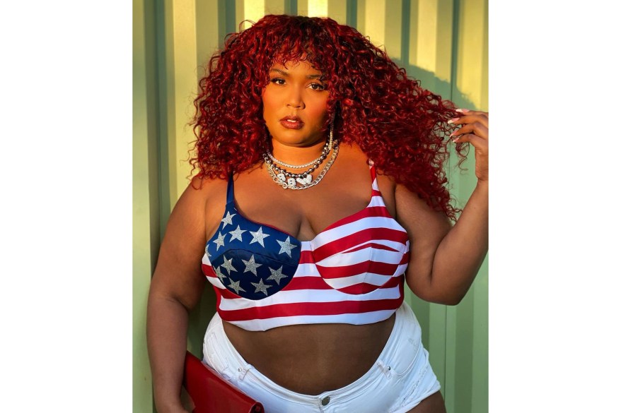 Lizzo dons a red, white and blue bustier for a trip to the ballot box.