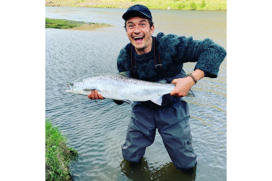 "Remember to smile especially when you 'cast that ballot' then release it into the mail box," jokes Orlando Bloom while fishing.