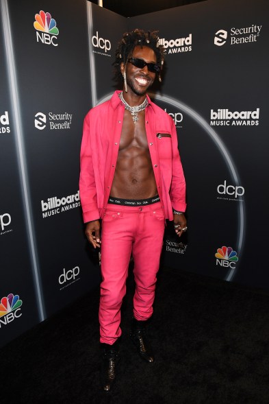 Ahead of his performance, Saint Jhn posed in this hot pink ensemble.