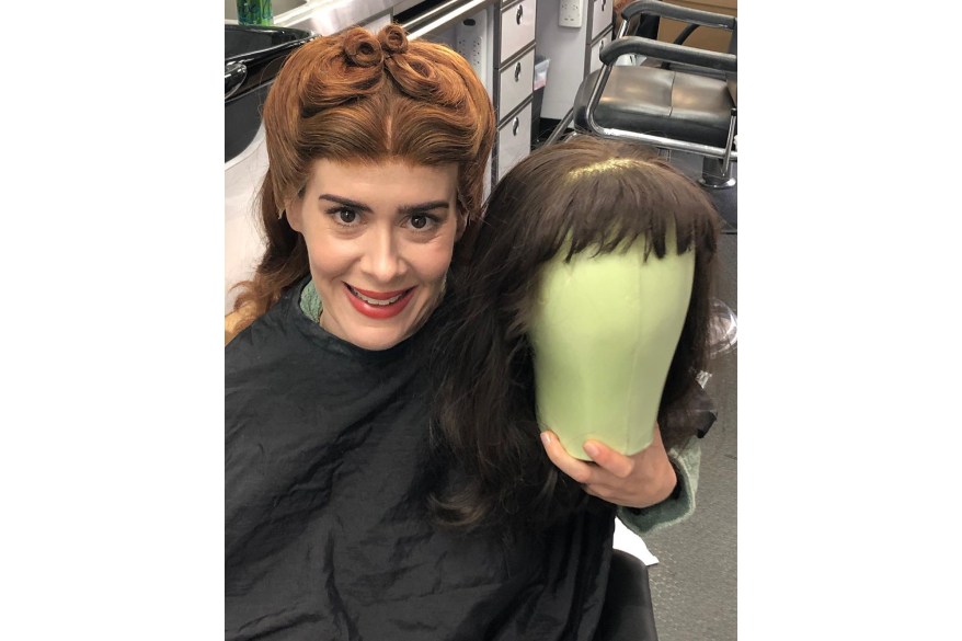 Sarah Paulson poses with her many wigs on the set of her Netflix show, “Ratched.”