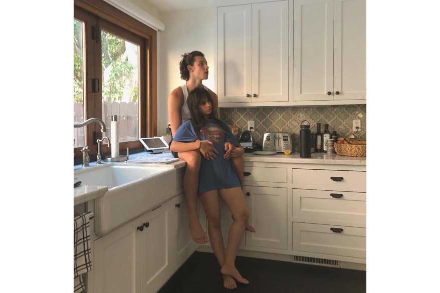 In Miami, Shawn Mendes and Camila Cabello cuddle in the kitchen.