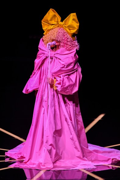 Sia performed in screaming pink Dolce & Gabbana Alta Moda.