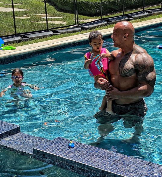 Dwayne "The Rock" Johnson with his daughters