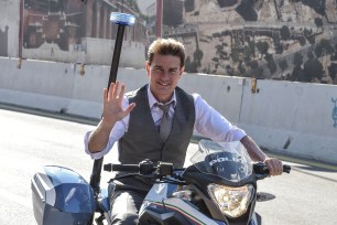 Tom Cruise rides a police motorbike in Rome on the set of "Mission Impossible 7."