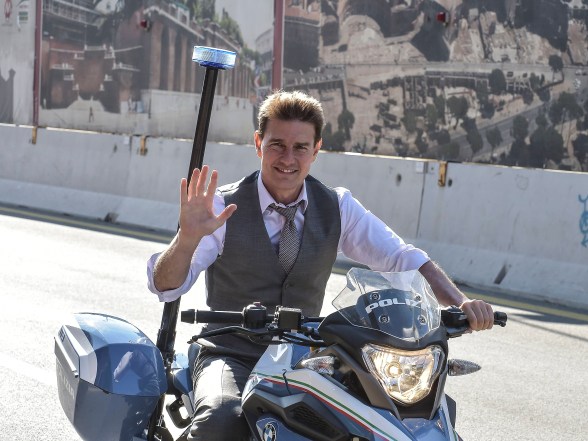 Tom Cruise rides a police motorbike in Rome on the set of "Mission Impossible 7."