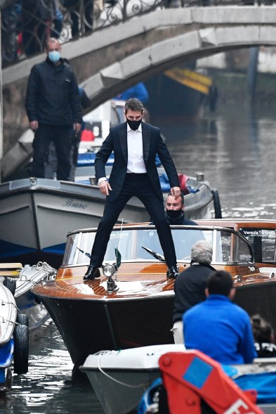 Tom Cruise does stunt work on boats in the Venetian canal while filming "Mission Impossible."