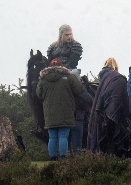 Henry Cavill looks battle ready while filming "The Witcher."