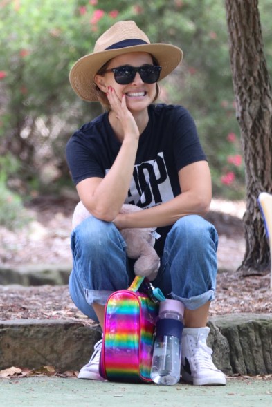 Natalie Portman flashes a wide smile while visiting her family in Sydney, Australia.