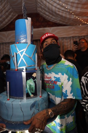 Odelle Beckham Jr. posing with his cake