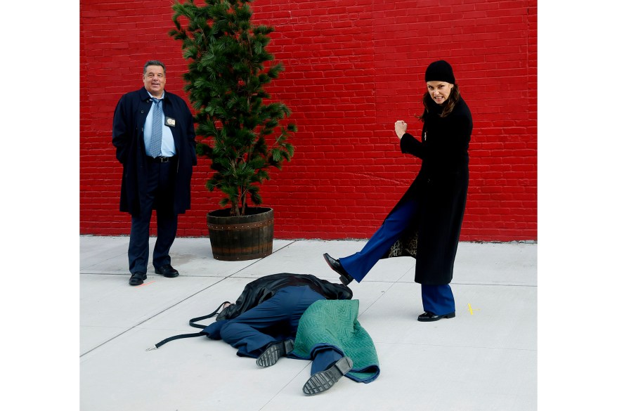 Steve Schirripa (left) and Bridget Moynahan joke around on the set of "Blue Bloods" in New York City.