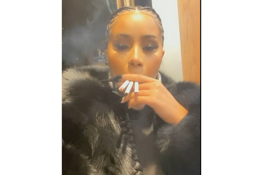 Cardi B takes a drag from three cigarettes simultaneously as she waits for election results.