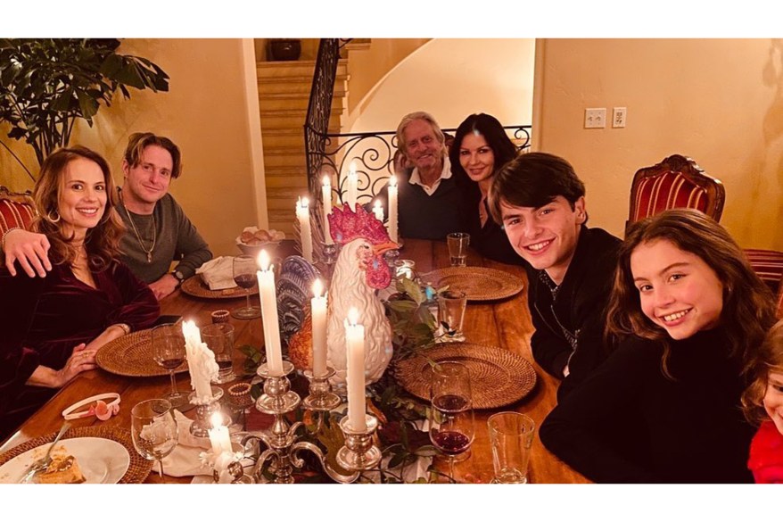 Michael Douglas and Catherine Zeta-Jones (clockwise from back) join their kids Dylan and Carys, along with Vivian Thibes and her partner Cameron Douglas (Michael's son), for a Thanksgiving celebration.