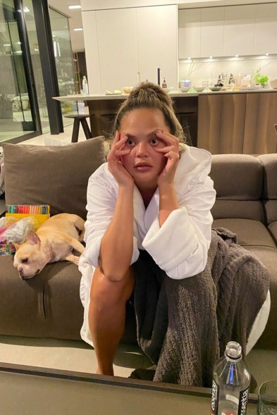 Chrissy Teigen holds her lids open while watching MSNBC's Steve Kornaki cover the electoral map.