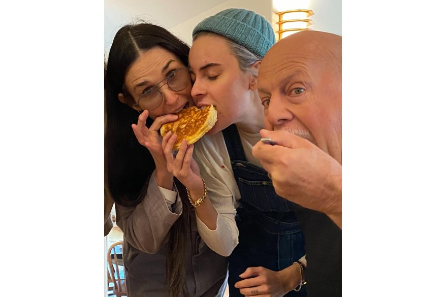 Demi Moore (from left) enjoys a birthday treat with her daughter Tallulah and ex-husband Bruce Willis in Montana.