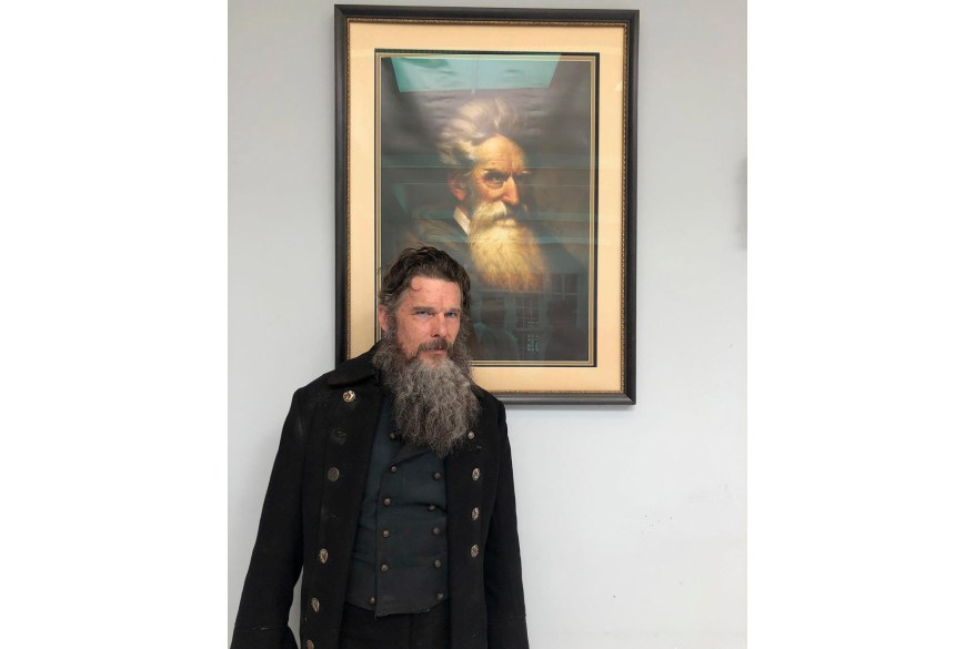 Ethan Hawke stands in front of a painting of abolitionist John Brown, who Hawke portrays in his new miniseries "The Good Lord Bird."