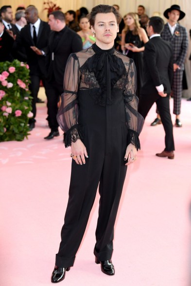 As a host of the 2019 Met Gala, Styles embraced the "camp" theme in a sheer Victorian-inspired Gucci top with ruffles, ultra-high-waisted pants and his now-infamous pink and blue manicure.