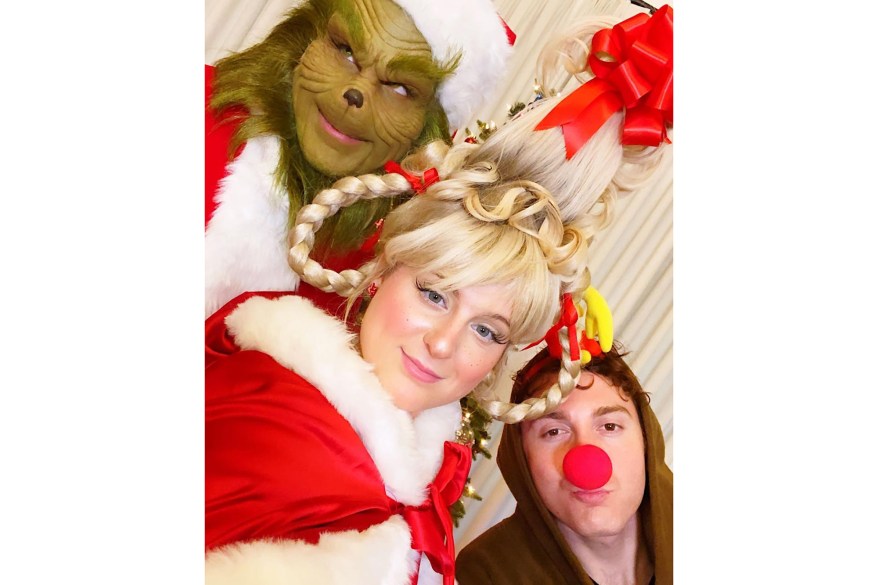 Meghan Trainor, dressed as Cindy Lou Who, brother Ryan Trainor (left), in a Grinch costume, and