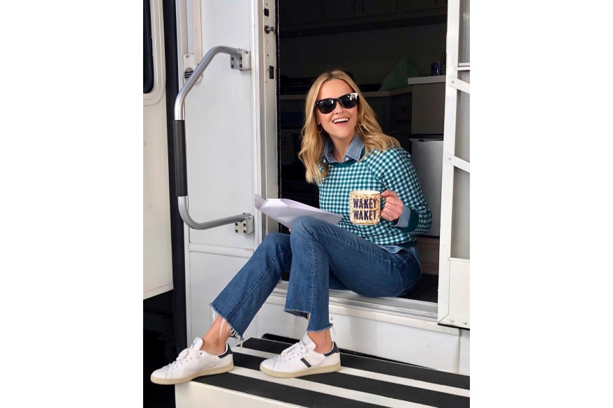 Reese Witherspoon reads a script on the set of Season 2 of "The Morning Show."