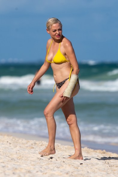 Despite a broken wrist, Rose McGowan relaxes on the beach in Tulum, Mexico.