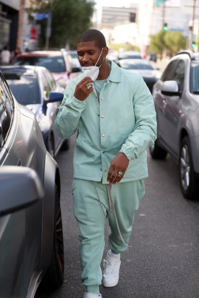 Usher looks stylish in a monochromatic outfit as he grabs lunch with a friend in West Hollywood.