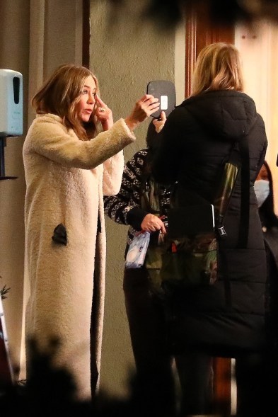 Jennifer Aniston touches up her makeup on the set of “The Morning Show” in LA.