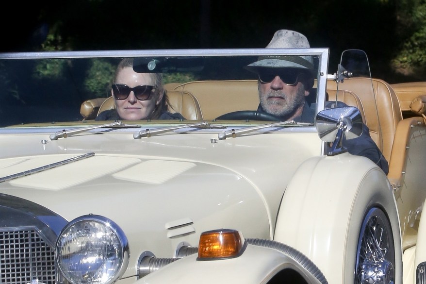 Arnold Schwarzenegger takes a Sunday afternoon joyride in his classic Mercedes convertible with his girlfriend, Heather Milligan.