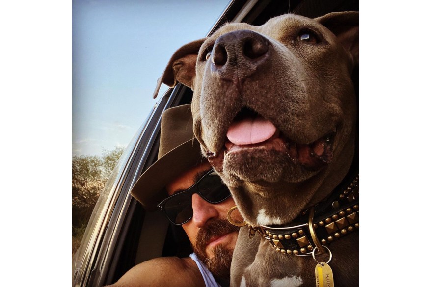 In Mexico, Justin Theroux celebrates “hump day” in the car with his pooch, Kuma.