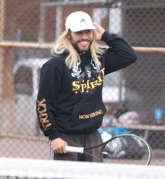 Pete Wentz sports long blonde hair while playing tennis in Los Angeles.