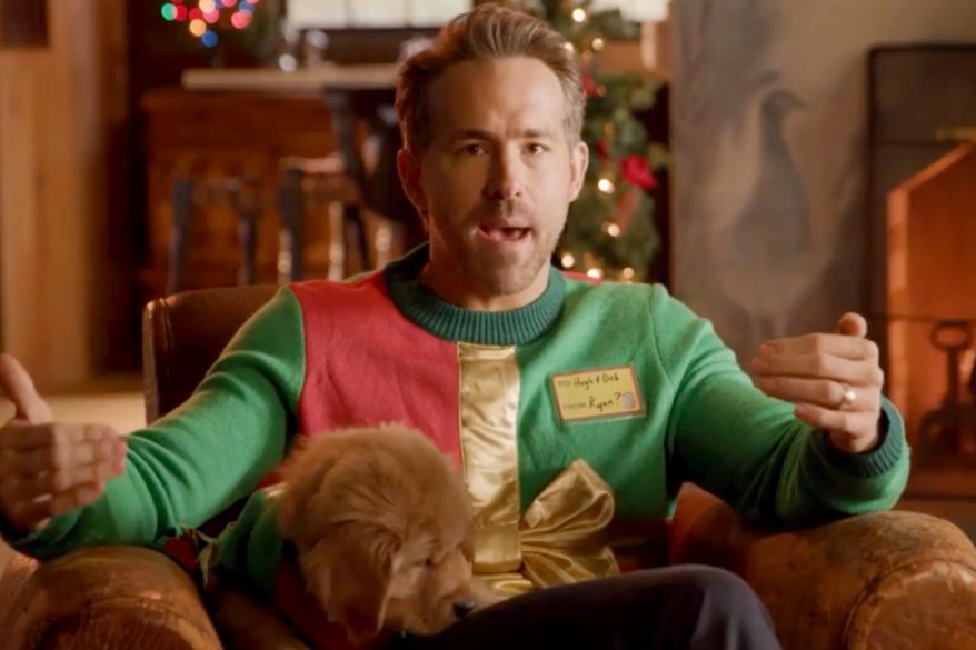 Ryan Reynolds dons an ugly Christmas sweater while fund-raising for the Hospital for Sick Children in Toronto.