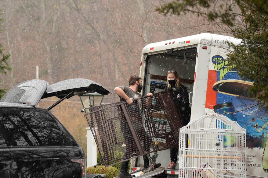 Sandra Lee packing her belongings into a moving van.