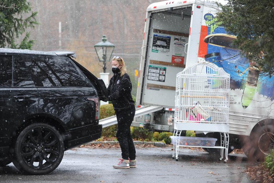 Sandra Lee packing her belongings into a moving van.