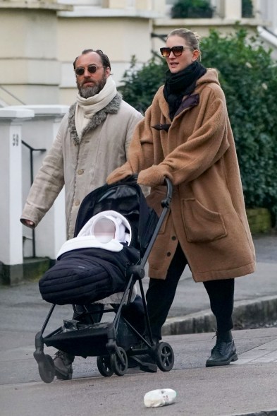 Jude Law and wife Phillipa Coan take their new baby for a stroll through London.