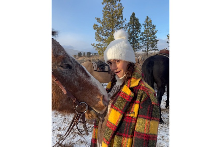 Nina Dobrev — who has reportedly been dating Olympian Shaun White — cuddles up to a horse in Montana.